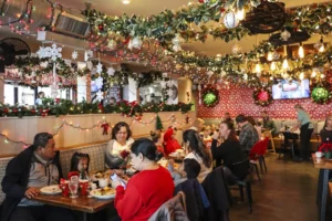 Holiday marketing ideas for restaurants and bars: guests at a festive holiday brunch at Harry's Jingle Bar in Cape May